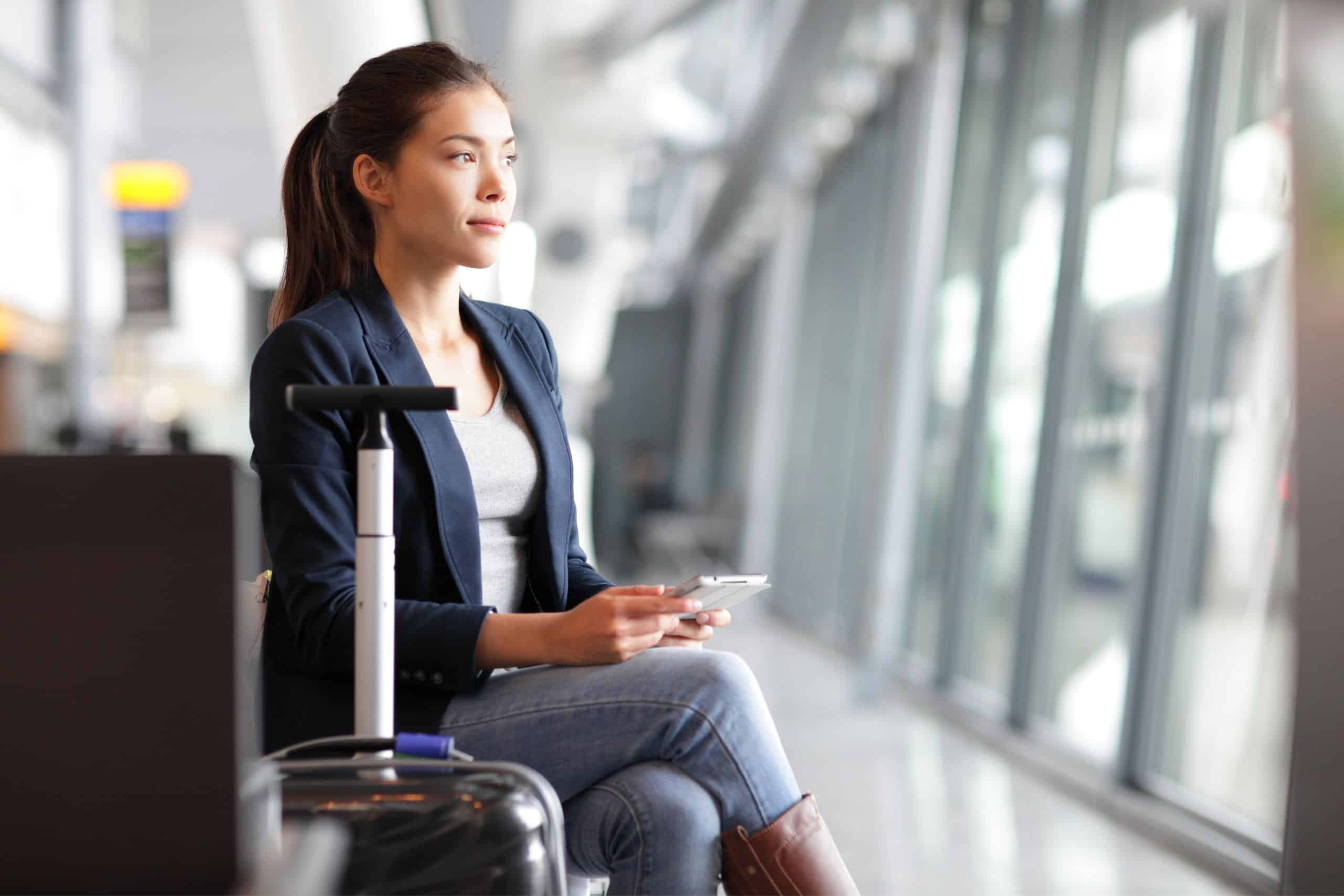 woman with pony tail prepared to board her airplane 